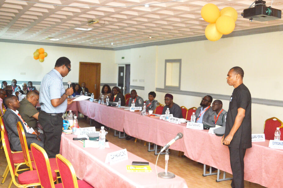 A delegate in discussion with the panel